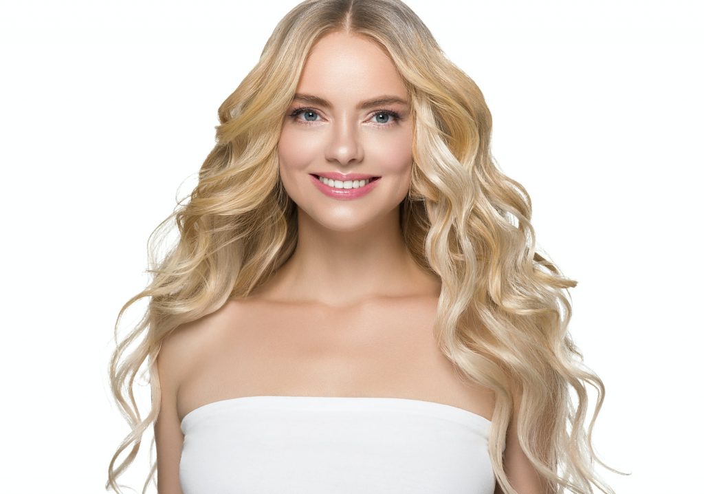 Teeth smile woman face blonde hair natural make up clean beauty healthy skin hait and teeth